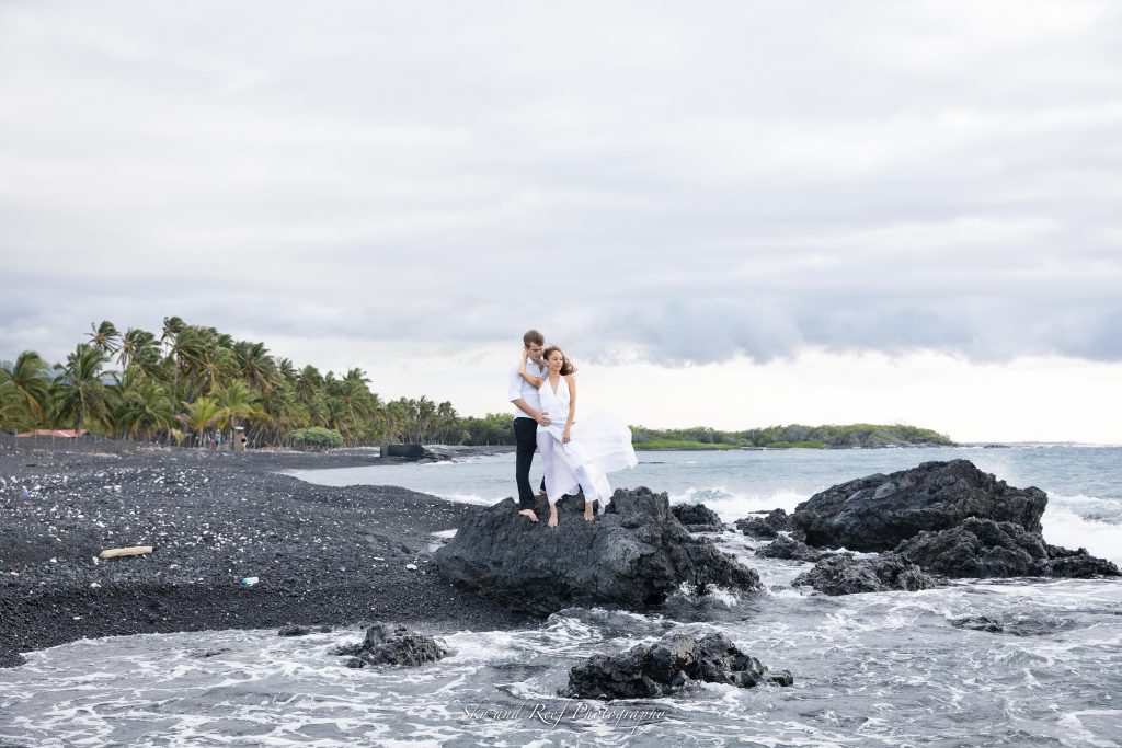 fiance stand next to each other for photos beach