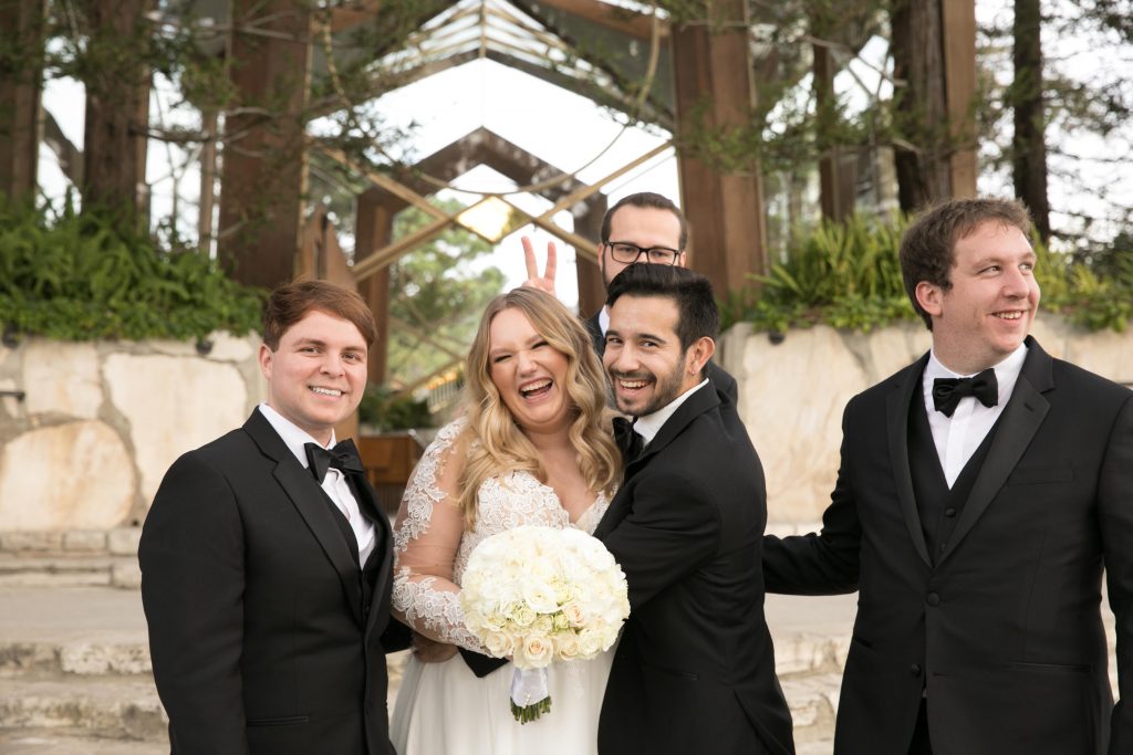 bride and groomsmen act silly bunny ears