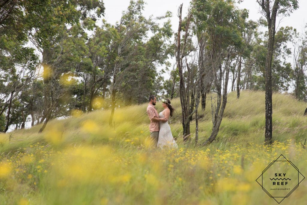 couple in field near Anna's Ranch Waimea