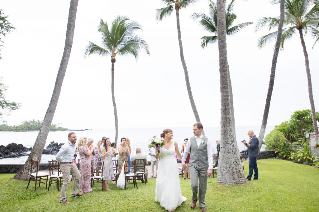 couple get married in Hawaii with palm trees Kealakekua Bay Wedding Venue